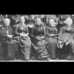 Women's History group of women sitting for photo.